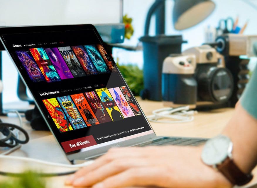 person using their laptop to scroll through movies on a website developed by JLB in nashville